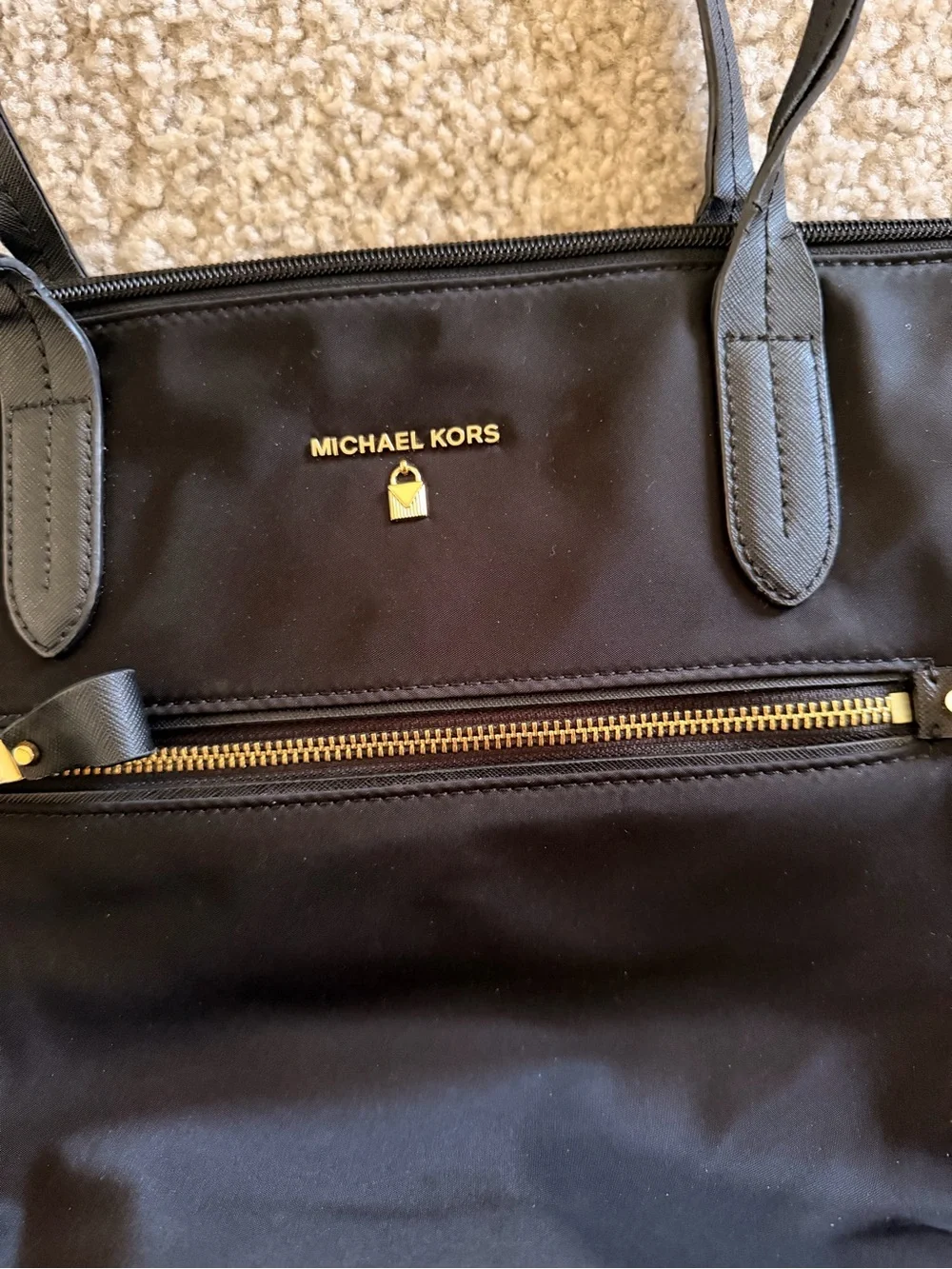 Michael Kors polished logo